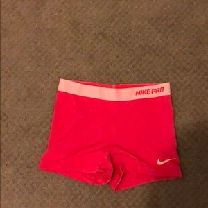 Nike, cranberry colored athletic shorts